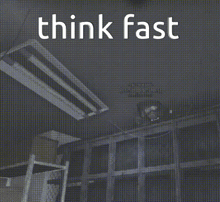 a black and white photo of a room with the words think fast written on it