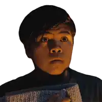 a young man with a surprised look on his face is holding a towel