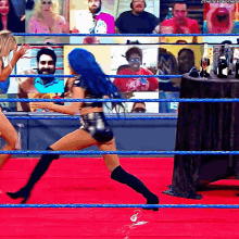 a woman in a wrestling ring with a watermark that says ' the next thing '