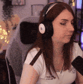 a woman wearing headphones and a shirt that says sound club on it