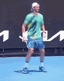 andrea vavassori jumping in place tennis return of serve ready position