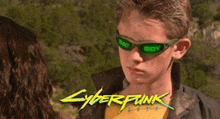 a boy wearing sunglasses that say bad boy is standing next to a woman