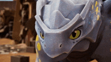 a close up of a cartoon character with a helmet on