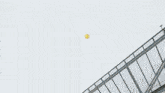 a large fireball is coming out of the sky above a building
