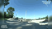 a jukin video shows a person riding a skateboard on a ramp