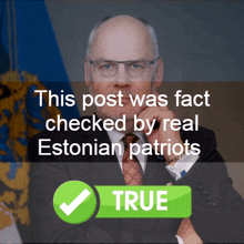 a man in a suit and tie stands in front of a check mark that says " true "