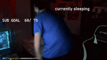 a man is currently sleeping in front of a computer screen