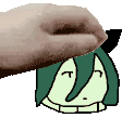 a hand is holding a cartoon character 's head with horns on it .