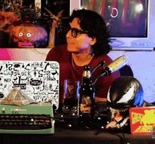 a man sitting at a table with a sticker on his laptop that says ' laplock ' on it