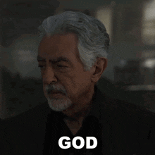 a man with a beard is saying damn it