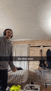 a man wearing headphones is standing in a room with the words me when aram written on the bottom