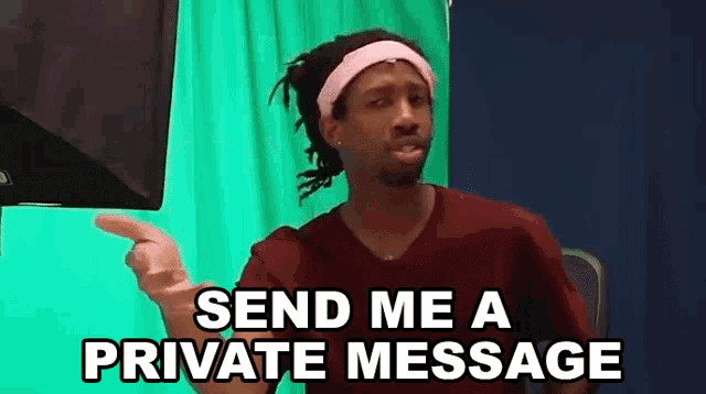 a man with dreadlocks and a pink headband is pointing at a green screen and saying send me a private message .