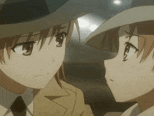 a couple of anime characters are looking at each other . one of the characters is wearing a hat .