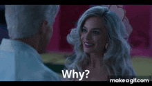 a man and a woman are looking at each other and the woman is asking the man why