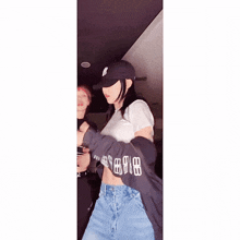 a woman wearing a hat and a shirt that says ' 88 ' on the sleeves