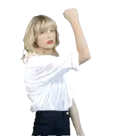 a woman in a white shirt and black pants is holding up her fist