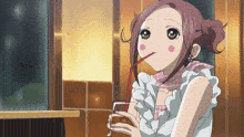 a girl with a straw in her mouth drinking from a cup