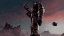 a giant robot with a gun stands in front of a pink sky