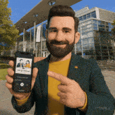 a man with a beard is holding a smart phone that says energy journey on it