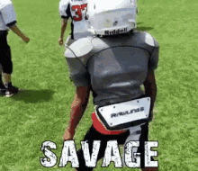 a football player with the word savage on the back of his jersey .