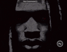 a black and white image of a man 's face with a run command icon above it