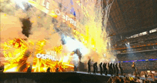 a group of people standing on a stage with a sign that says will osprea