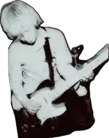 a black and white photo of a man playing a guitar that says mick jagger on it