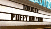 a sign for tonight 's puffy amiyumi is lit up
