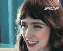 a close up of a woman 's face with the words seventeen on the bottom