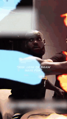a man in a black shirt with the word draw written on it