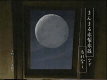 a person is holding a glass in front of a picture with chinese writing on it