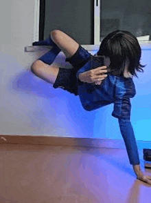 a person is taking a selfie with their phone while standing on one leg .