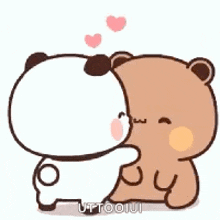 a panda bear and a brown bear are hugging each other .