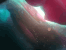 a blurred image of a person 's face with a red and blue background