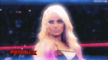 a woman in a wrestling ring with payback written on the bottom