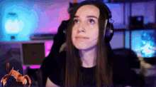 a woman wearing headphones is looking up at something