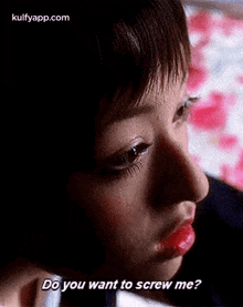 a close up of a woman 's face with red lips and the words `` do you want to screw me ? ''