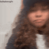 a blurry picture of a woman with the words baileybassgifs below her