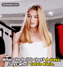 a woman in a white dress says what the hell is that ? a dress , says who ? calvin klein .