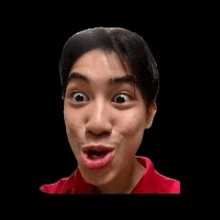 a young man wearing a red shirt is making a funny face .