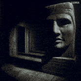 a black and white photo of a statue with luma written on the bottom left