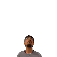 a man with glasses and a beard is looking up at the number 20