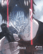 a tiktok video of a man with a knife and the word haiko on the bottom