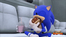 sonic the hedgehog eating a hot dog and drinking a milkshake
