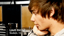 a close up of a young man with the name liam payne