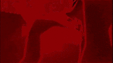 a group of people are standing in a dark room with a red swirl in the middle