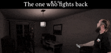 a man is standing in a dark room with the words the one who fights back above him