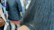 a woman 's hair is visible in a blurry photo with a watermark that says " permanent cosmetics "