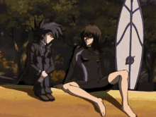 a man and a woman are sitting next to each other on a beach with a surfboard in the background .