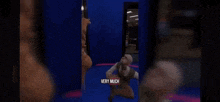 a man is kneeling down in front of a door in a video game .